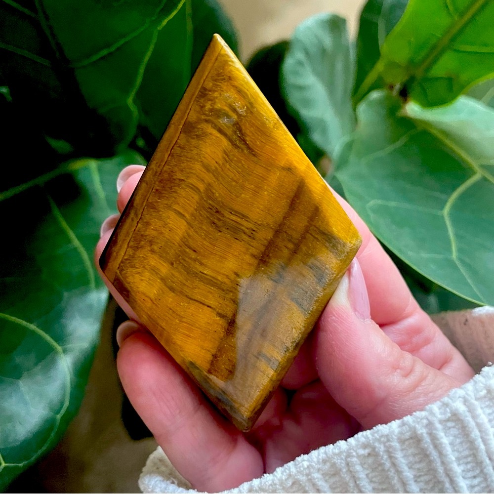 Polished tiger eye faceted gem diamond crystal